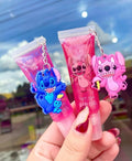 Gloss con colgante Stitch y Angela