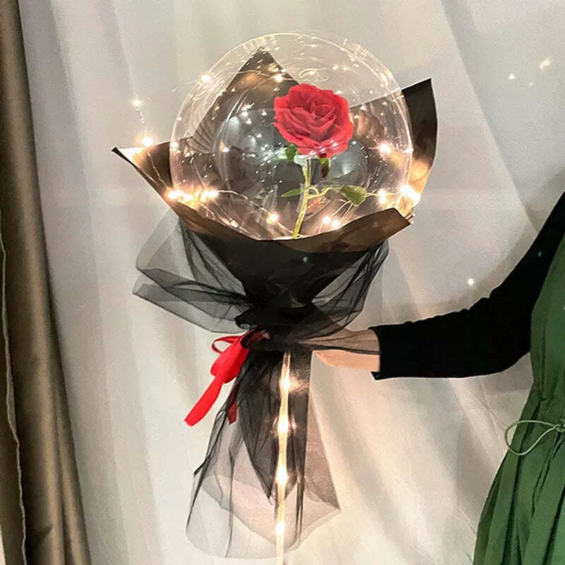 Flor en globo con luces